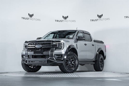 2022 Ford Ranger Sport 4WD in silver fitted with Covert RTO6 18x9 Matt Black alloy wheels and Grenadier mud-terrain tyres — front three-quarter view