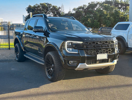 2026 Ford Ranger Platinum in black fitted with BGW Shadow Matt Black alloy wheels and Firestone Destination X/T 275/55R20 all-terrain tyres — front three-quarter view