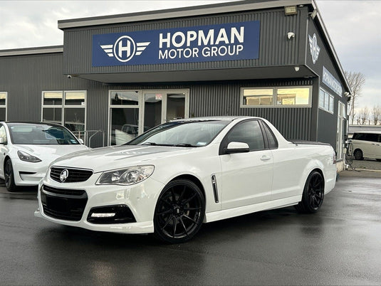 2013 Holden Commodore VF SS Ute in Heron White fitted with BGW Circuit Gloss Black alloy wheels — front three-quarter view at Hopman Motor Group