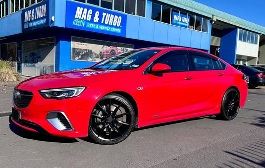2019 Holden Commodore VXR in red fitted with Covert CV6 20x8.5 alloy wheels in Gloss Black — front three-quarter view