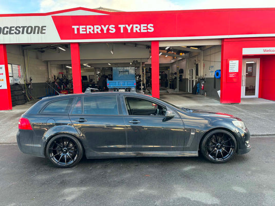 2015 Holden Commodore VF Sportwagon in dark grey on BGW Circuit 20-inch Gloss Black staggered alloy wheels — full side profile at Terry's Tyres