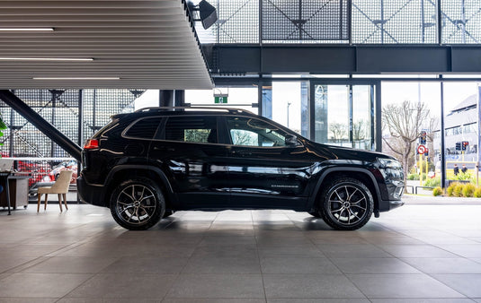 2021 Jeep Cherokee Limited in black fitted with BGW Compton Gloss Black Machined Face alloy wheels — full side profile in showroom