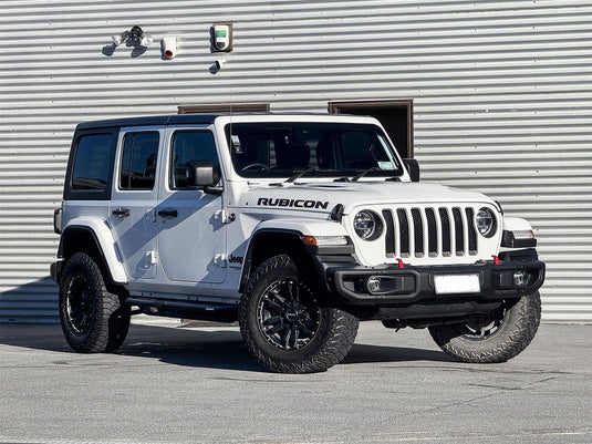 2020 Jeep Wrangler Unlimited Rubicon in Bright White with lift kit fitted with ROH Vapour Matt Black 18-inch alloy wheels and AMP M/T tyres — front three-quarter view at Iconic Car Care