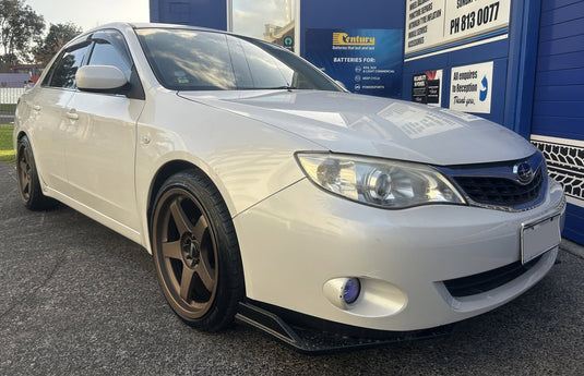 2011 Subaru Impreza sedan in white with lip kit fitted with BGW DC Five Bronze 18x8.5 wheels and 225/40R18 performance tyres — front three-quarter view